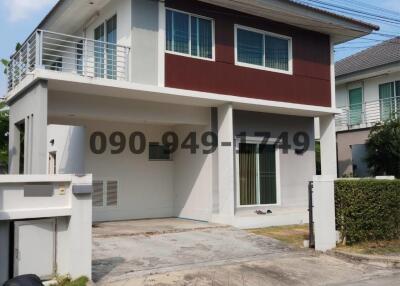 Modern two-story residential building with ample parking space