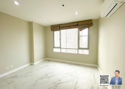 Spacious and bright empty room with large windows and marble flooring