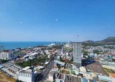 Panoramic aerial view of a coastal city from a high-rise building