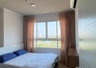 Bright bedroom with a large window and view