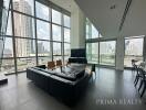 Spacious modern living room with large windows and city view