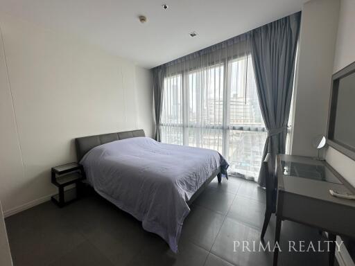 Modern bedroom with natural lighting and city view