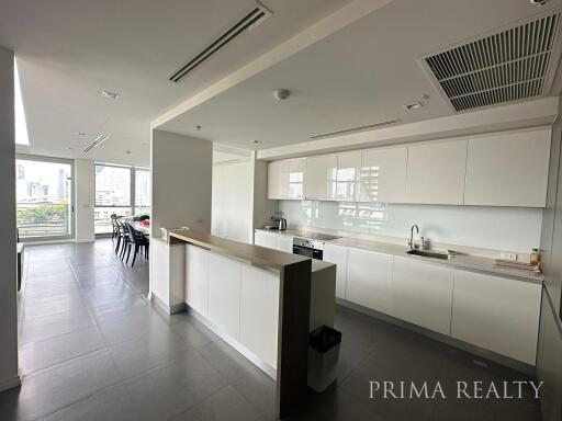 Spacious modern kitchen with large windows and ample lighting