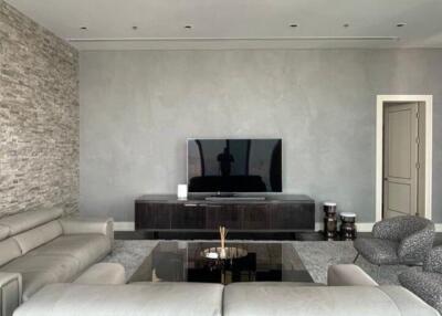 Modern and stylish living room interior with large sectional sofa and television