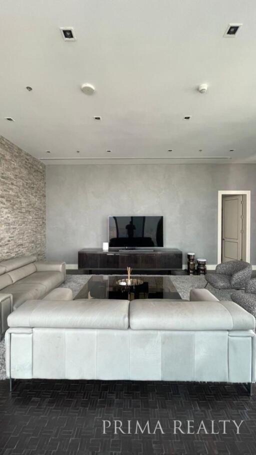 Modern and stylish living room interior with large sectional sofa and television