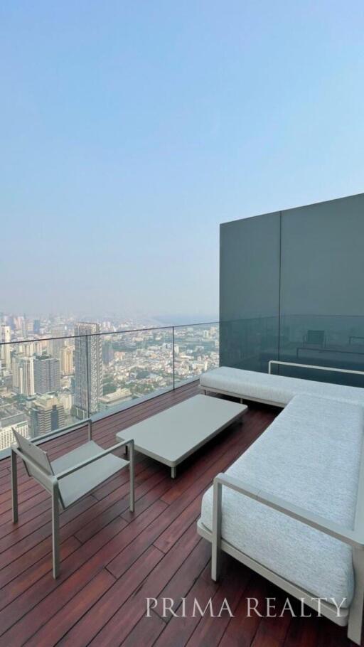 Spacious outdoor terrace with panoramic city view and modern furniture