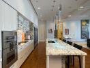 Modern kitchen with marble countertops and built-in appliances