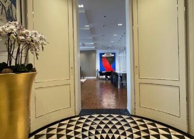 Elegant hallway leading to a spacious interior living space