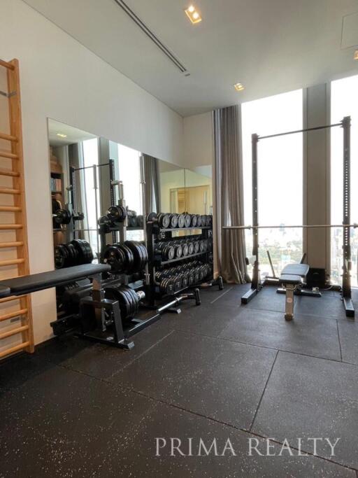 Home gym with exercise equipment and city view