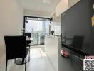 Modern kitchen with dining area and large window