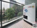 Apartment balcony with safety netting and outdoor washing machine