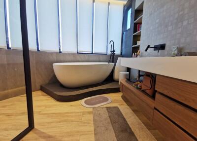 Modern bathroom with freestanding tub and elegant finishes