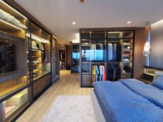 Spacious bedroom with a walk-in closet and modern design