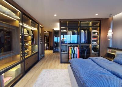 Spacious bedroom with a walk-in closet and modern design