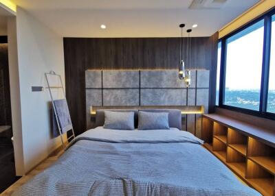 Modern bedroom with a double bed and a scenic view
