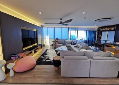 Modern spacious living room with sea view and open-plan design