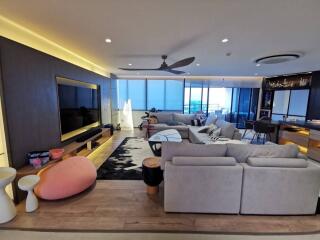 Modern spacious living room with sea view and open-plan design