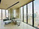 Spacious living room with large windows overlooking the city skyline and river