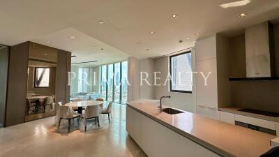 Modern kitchen with dining area and floor-to-ceiling windows