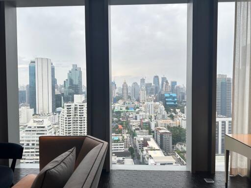 High-rise living room with expansive city view through floor-to-ceiling windows