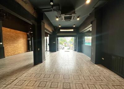 Spacious commercial space with patterned tile flooring and large front windows