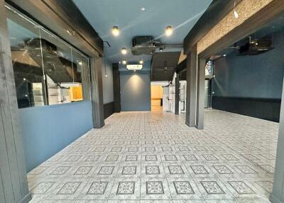 Open space interior of a building with tiled flooring