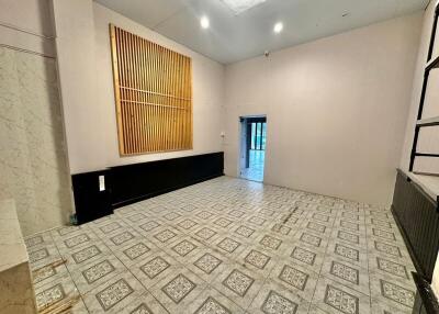 Spacious interior of a building with decorative walls and patterned floor tiles