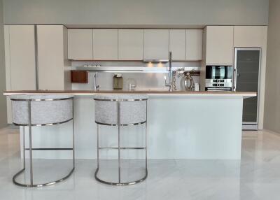 Modern spacious kitchen with island and bar stools