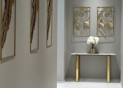 Elegant hallway interior with decorative artwork and modern console table
