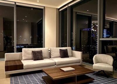 Modern living room with floor-to-ceiling windows and city view