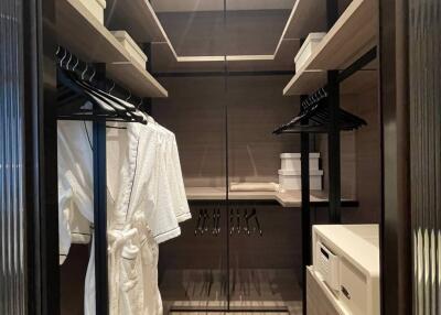 Elegant walk-in closet with ample shelving and modern design