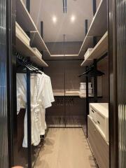 Elegant walk-in closet with ample shelving and modern design