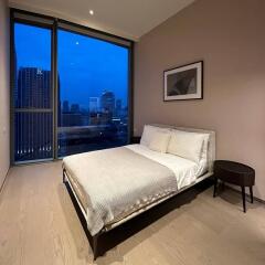Modern bedroom with large window city view