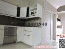 Modern kitchen interior with white cabinetry and appliances