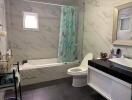 Modern bathroom with marble tiles and bathtub