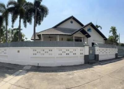 Exterior view of a residential home with gated compound