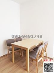Minimalist dining area with wooden table and chairs