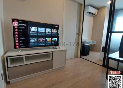 Modern living room with entertainment system and comfortable furnishings