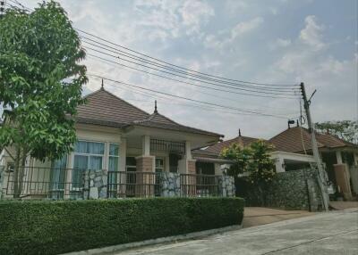 Spacious family house with tiled roof and stone fence