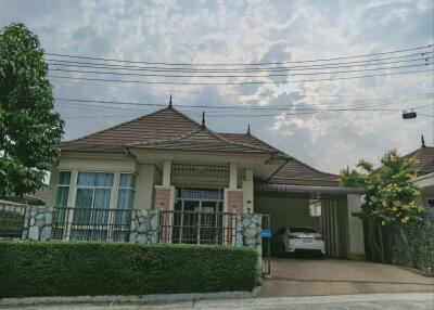 Suburban single-family house with tiled roof and garage