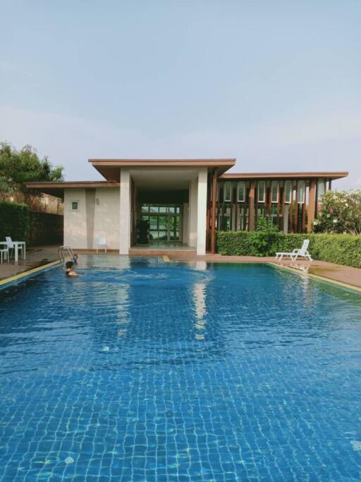 Luxurious outdoor swimming pool with a pool house