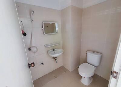 Compact bathroom with white fixtures