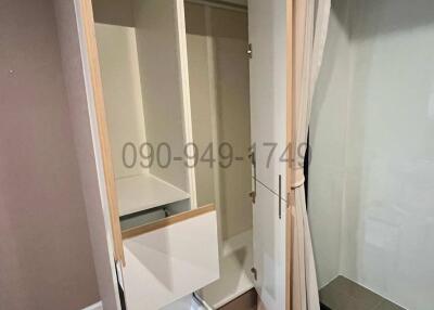 Compact bedroom with built-in wardrobe and wooden flooring