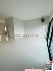 Spacious and brightly lit unfurnished living room with large window