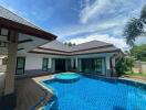 Spacious family home with a large swimming pool and garden