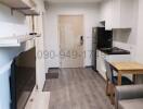 Modern kitchen with wooden shelves and laminate flooring