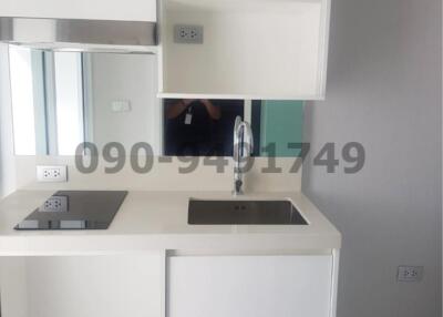 Modern kitchen with white cabinets and built-in appliances