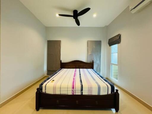 Spacious Bedroom with Queen-Sized Bed and Modern Amenities