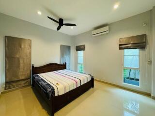 Spacious bedroom with queen-sized bed and modern amenities