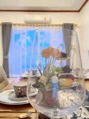 Elegant dining room with decorative flowers and modern styling